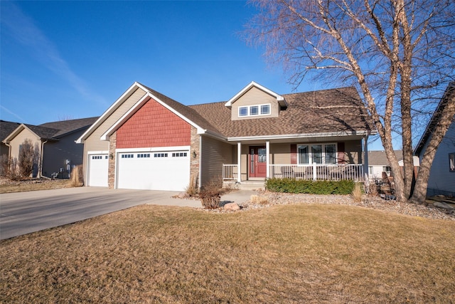 view of front of property featuring a garage, a front yard, and a porch