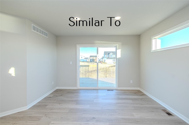 unfurnished room featuring light hardwood / wood-style floors