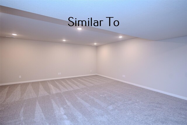 spare room featuring carpet flooring