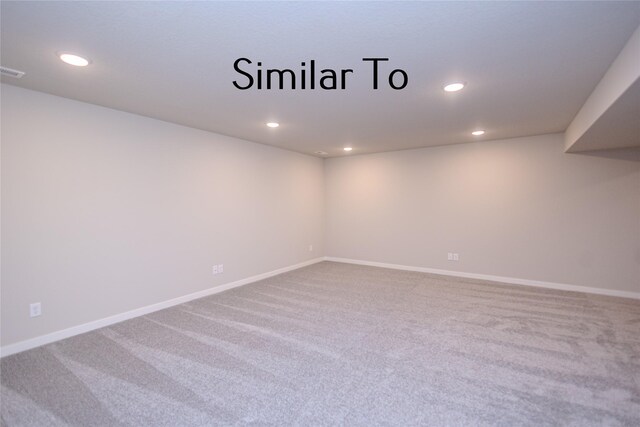 empty room with carpet flooring