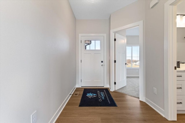 1902 16th Cir SE, Altoona, IA 50009 - doorway to outside featuring wood finished floors and baseboards