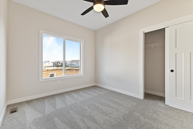 1902 16th Cir SE, Altoona, IA 50009 - unfurnished bedroom with carpet flooring, a closet, and a ceiling fan