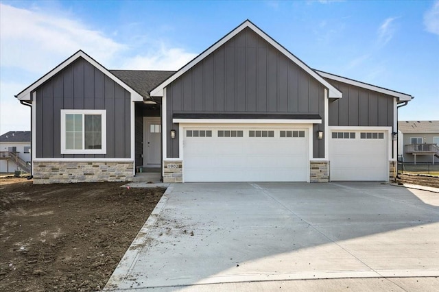 1902 16th Cir SE, Altoona, IA 50009 - modern farmhouse style home featuring stone siding, board and batten siding, and an attached garage