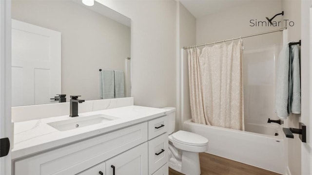 full bathroom with vanity, wood-type flooring, toilet, and shower / bath combo