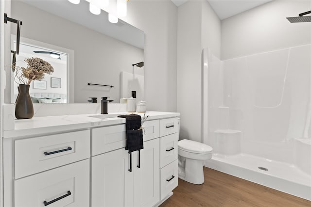 1632 20th Ave SE, Altoona, IA 50009 - full bath with vanity, wood finished floors, toilet, and a shower