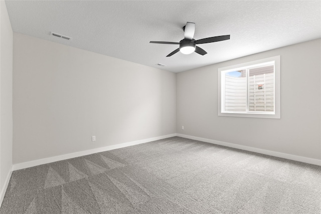 1632 20th Ave SE, Altoona, IA 50009 - carpeted spare room featuring a ceiling fan, a textured ceiling, and baseboards