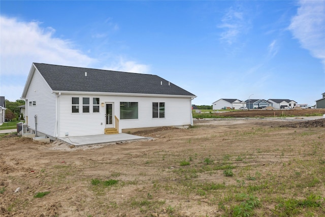 1632 20th Ave SE, Altoona, IA 50009 - rear view of house featuring a patio, entry steps, central air condition unit, and a shingled roof