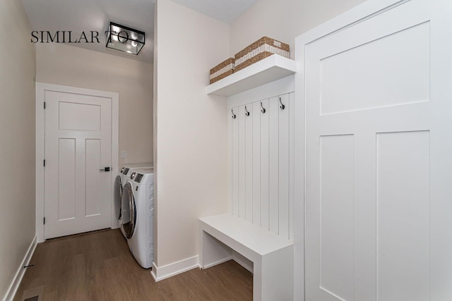 mudroom featuring independent washer and dryer and hardwood / wood-style floors