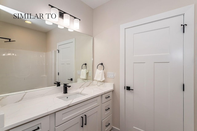 bathroom featuring vanity and a shower