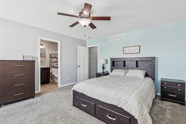 carpeted bedroom featuring ceiling fan and ensuite bathroom