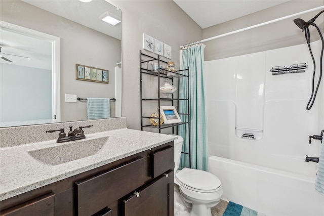 full bathroom with vanity, ceiling fan, toilet, and shower / bath combo with shower curtain