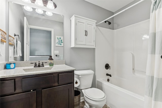 full bathroom with shower / bath combo, vanity, and toilet