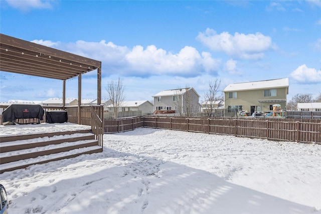 yard covered in snow featuring a wooden deck