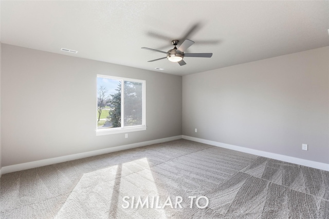 spare room featuring ceiling fan and carpet flooring