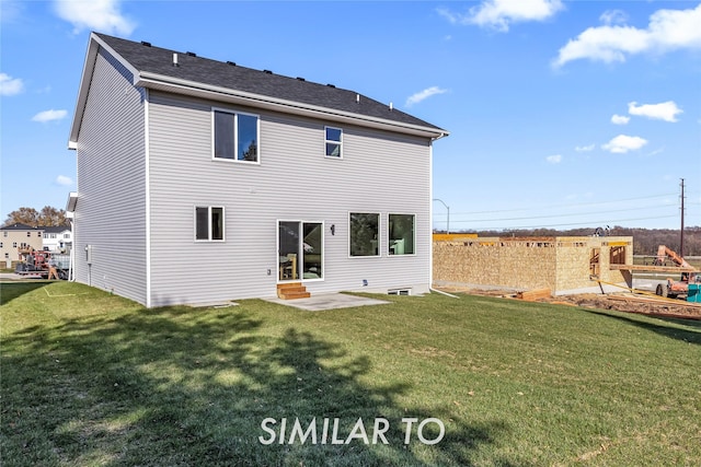 back of property with a patio area and a lawn