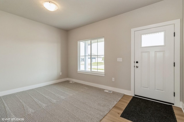 319 41st St SW, Altoona, IA 50009 - foyer entrance with baseboards and light wood-style floors