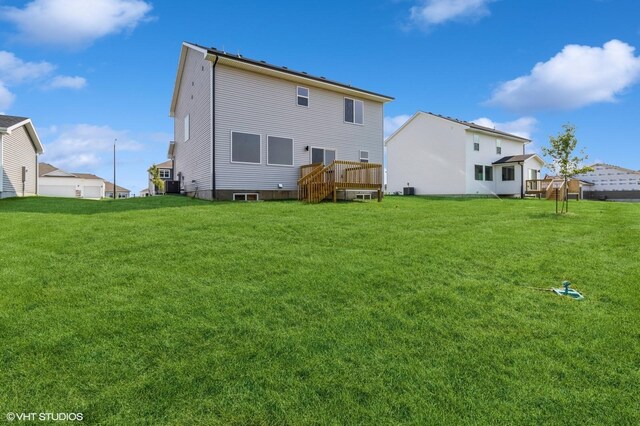 319 41st St SW, Altoona, IA 50009 - back of house with a lawn and a wooden deck
