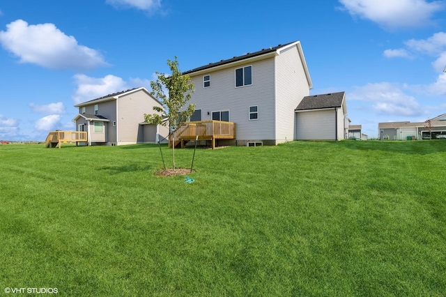 319 41st St SW, Altoona, IA 50009 - back of house featuring a wooden deck and a lawn