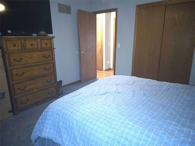 carpeted bedroom featuring a closet