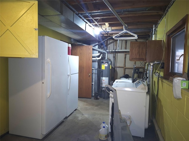 basement with water heater, separate washer and dryer, and white refrigerator