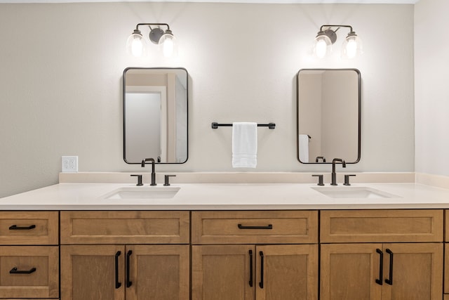 full bath featuring double vanity and a sink