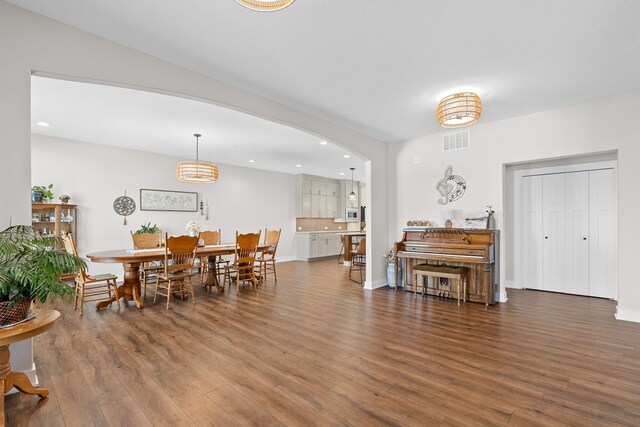 dining space featuring dark hardwood / wood-style floors