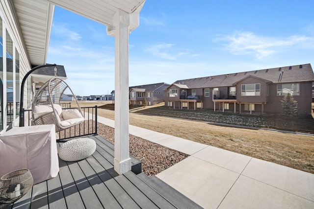 wooden deck with a residential view