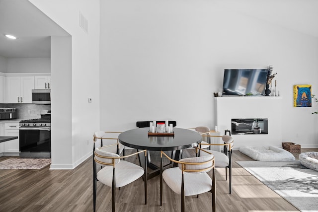 dining area featuring wood-type flooring