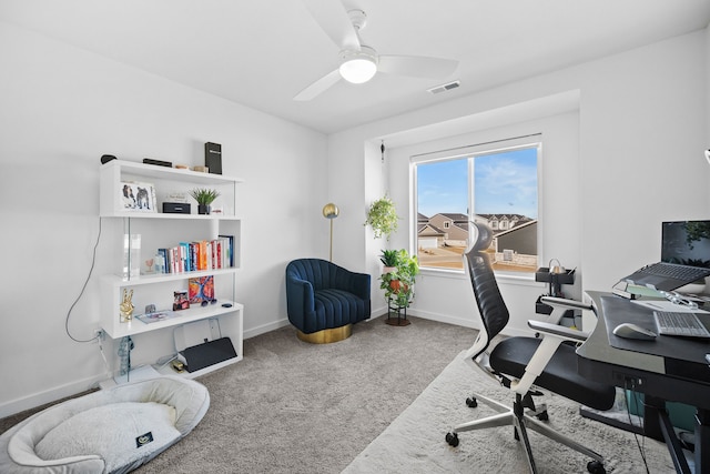 home office with ceiling fan and carpet floors