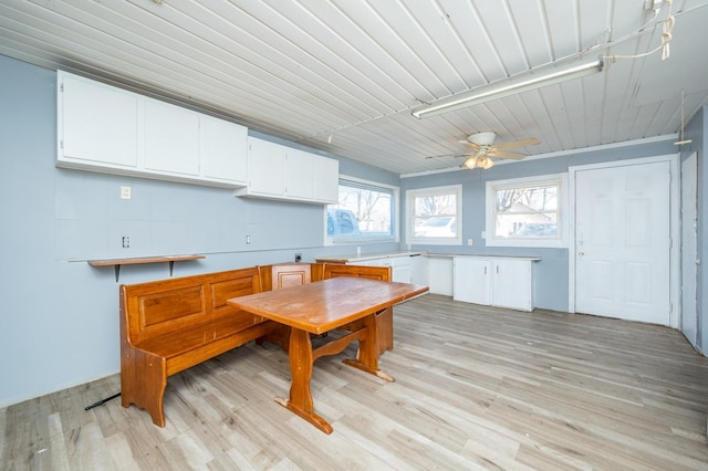 kitchen featuring white cabinetry and light hardwood / wood-style floors