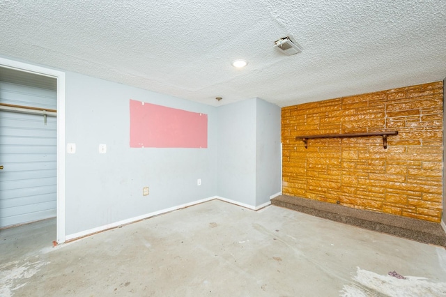 interior space with a textured ceiling