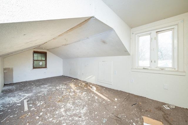 bonus room featuring vaulted ceiling