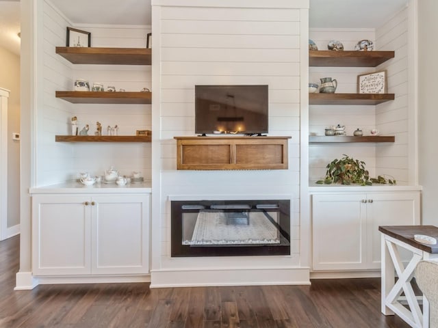 bar featuring white cabinetry and dark hardwood / wood-style floors