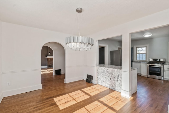 unfurnished dining area featuring hardwood / wood-style floors