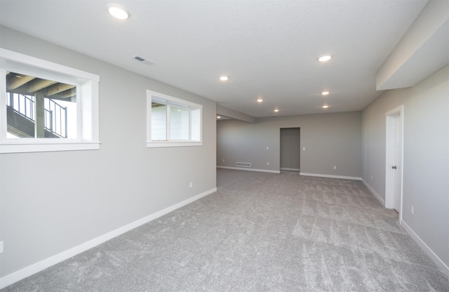 spare room with light colored carpet