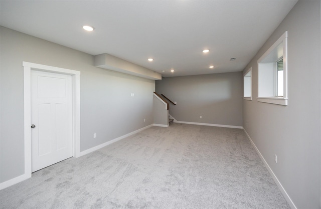 basement with light colored carpet