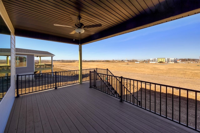 wooden terrace with ceiling fan and a rural view