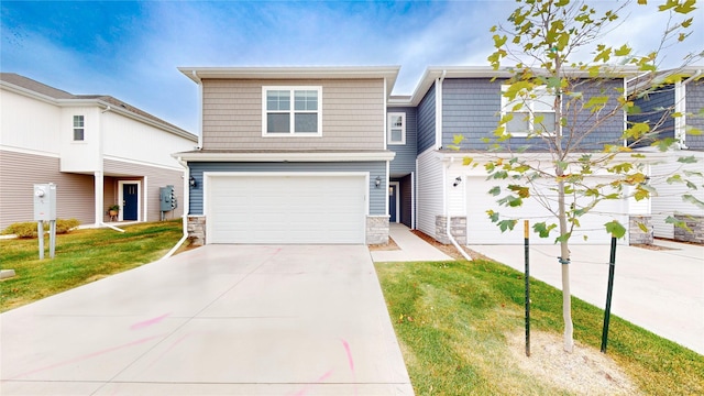 view of front of property featuring a garage and a front yard