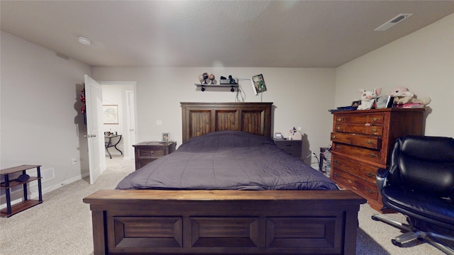 bedroom featuring light carpet