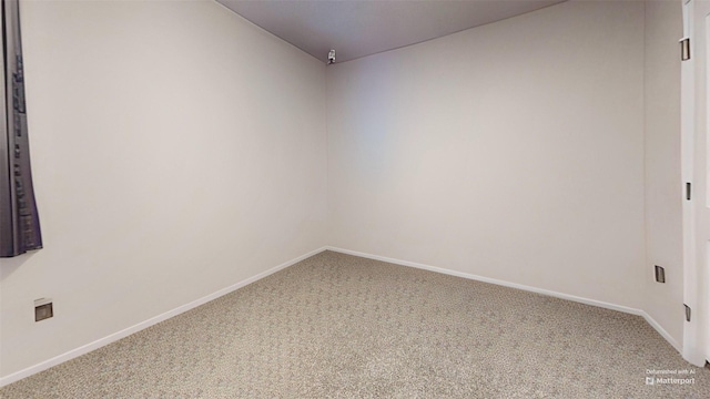 unfurnished room featuring carpet flooring