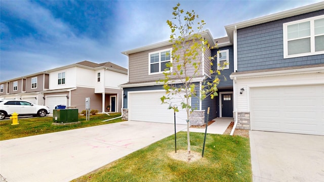 view of front of property featuring a garage and a front lawn