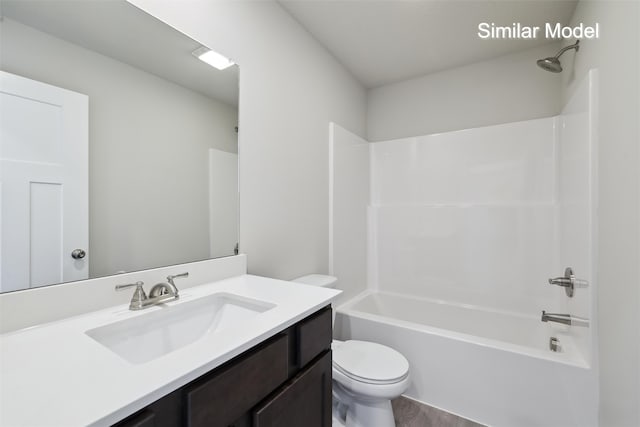 full bathroom featuring shower / tub combination, vanity, and toilet