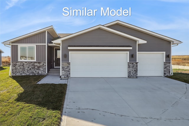 view of front facade with a garage and a front yard