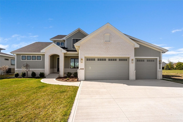 view of front of property featuring a garage and a front yard