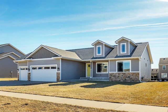 view of front facade with a garage and a front lawn