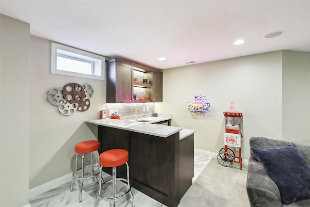 bar with tasteful backsplash and sink