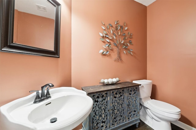 bathroom with sink and toilet