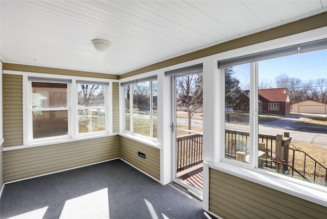 unfurnished sunroom featuring a wealth of natural light