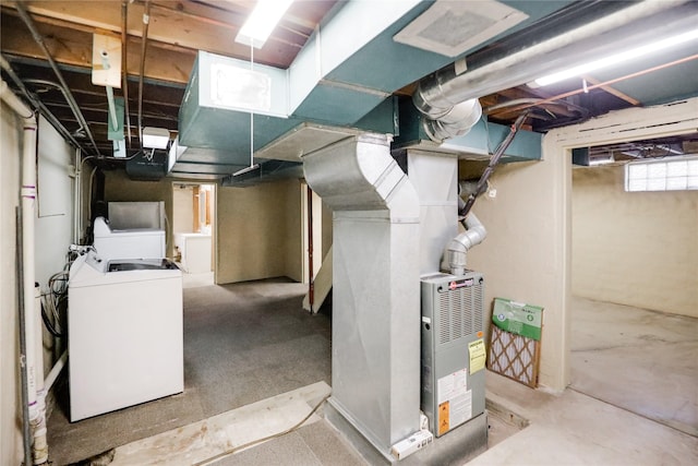 basement with heating unit and washer / clothes dryer