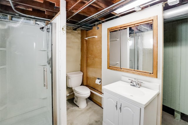 bathroom with concrete flooring, a shower, vanity, and toilet